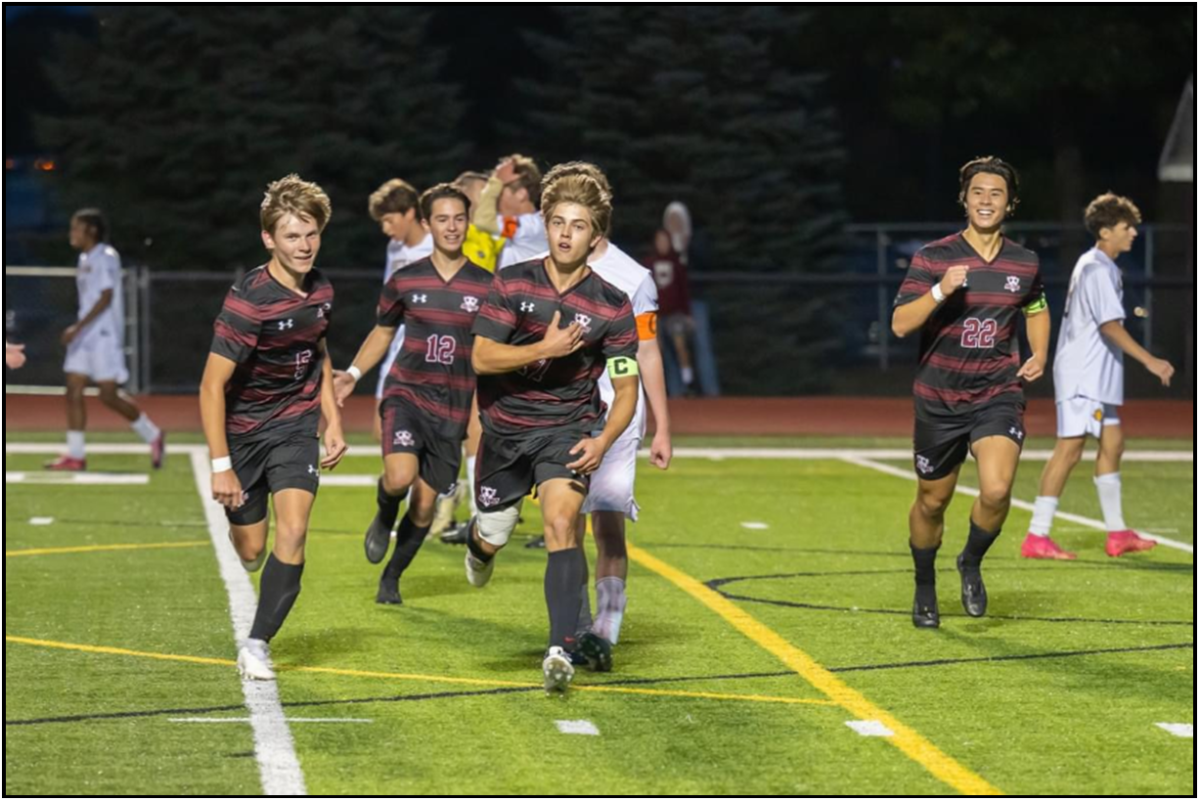 Senior Captain Cullen Broyles celebrates after scoring the leading goal in the LVC playoffs against South Lyon.  
