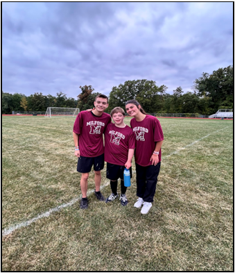 Evan Oliver poses after the game at Northern with friends Evan Eiss and Aleah Partyka (Photo courtesy of Kristin Partyka).
