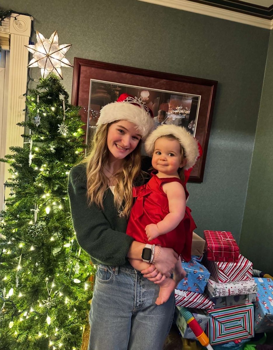 Grace Mead holding her niece Kennedy at their family’s Christmas party last year.
