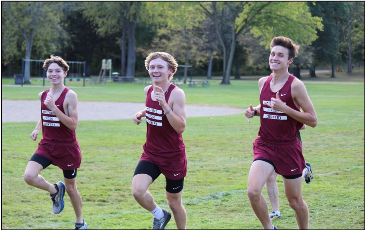 Todd Tobin, Josh Sanchez, and Ryan Carrannanto smiling during senior night.
