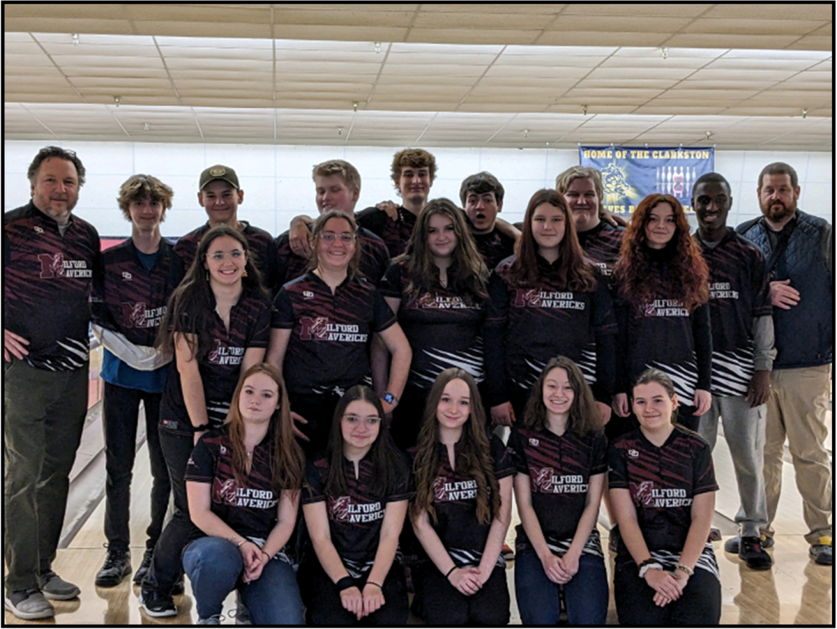 During  last year’s bowling season, the boys and girls team took a collective picture with their coaches, Bob Shafto (left) and Seth Stern (right).