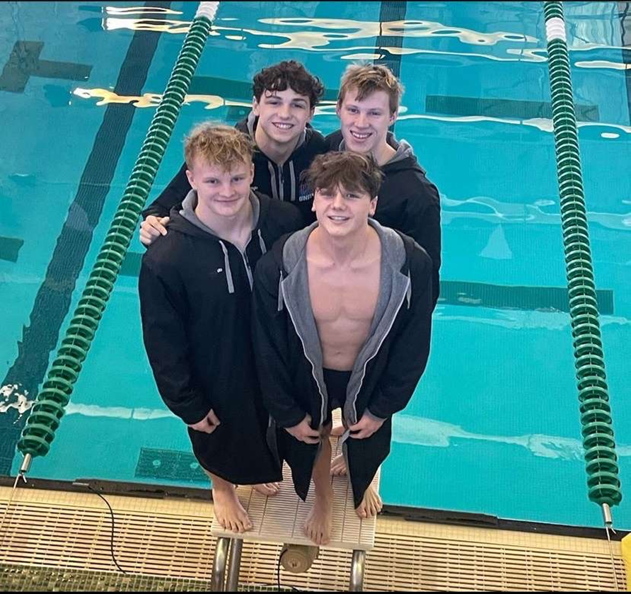 Boys relay of Marshall, Bonau, Shaw, and Armstrong after placing first in LVC meet in 200 freestyle relay. 
